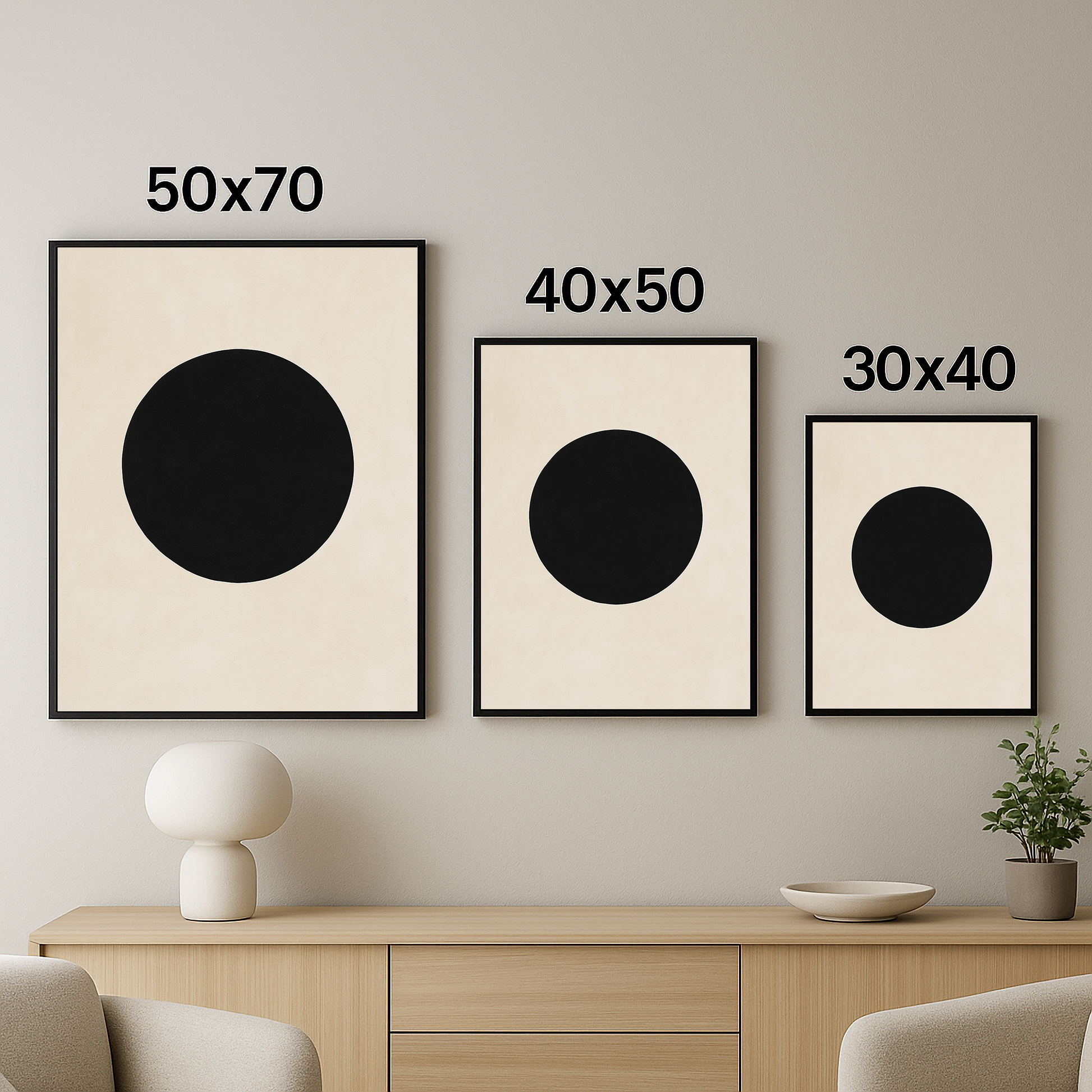 Üç farklı boyutta (50x70, 40x50, 30x40) sergilenen, siyah daire figürlü modern minimal tablo seti.